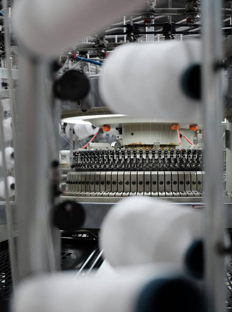 Advanced circular knitting machines running in-house fabric weaving at Lynmiss Factory